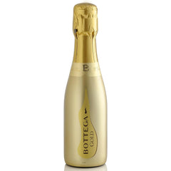 A metallic gold bottle of Bottega Prosecco with a foil cover on the top.
