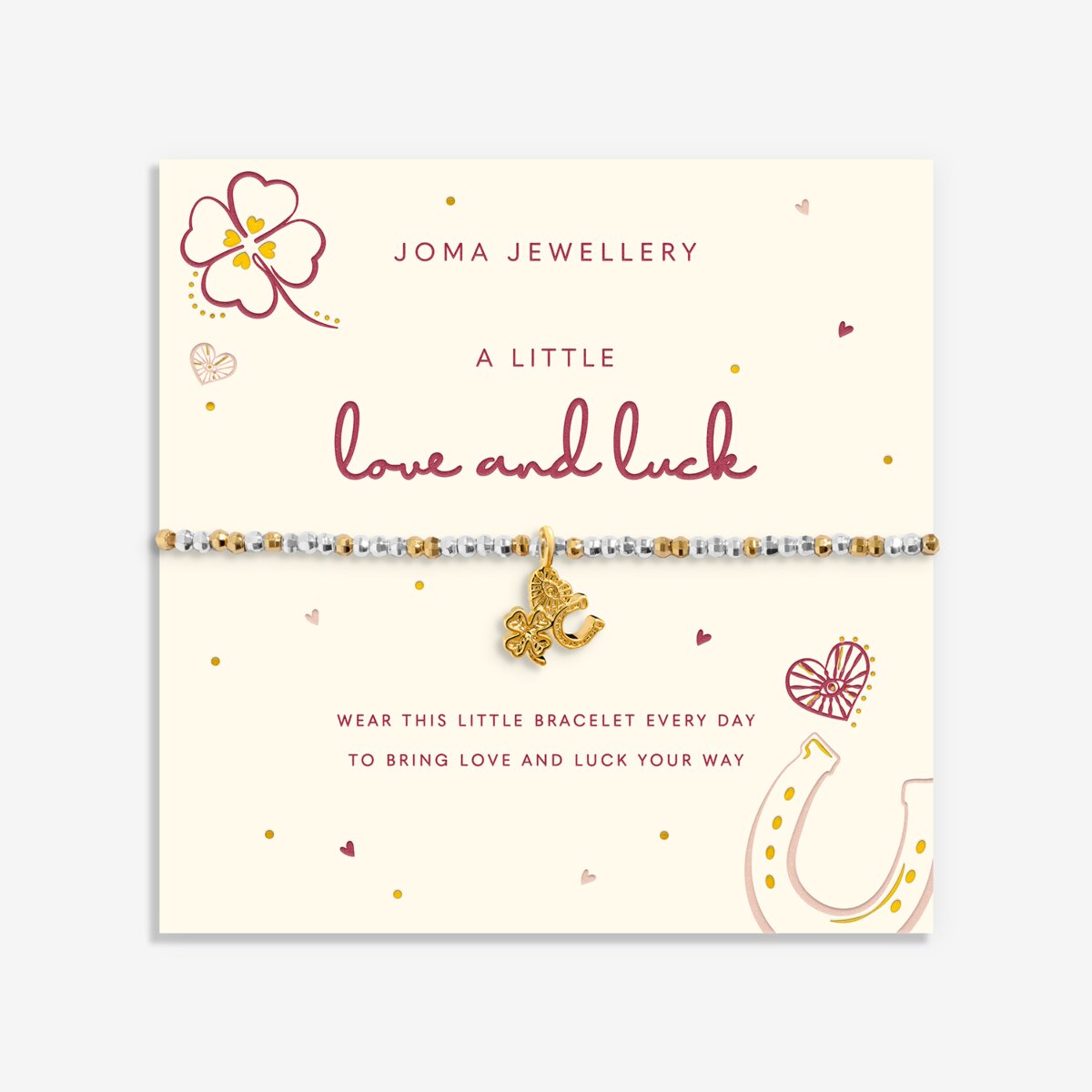 A Joma Jewellery bracelet on a cream display card. The bracelet features small white and gold beads with a gold elephant charm.