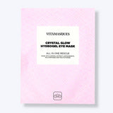 Vitamasques Crystal Glow Hydrogel Eye Mask packaging on a light pink background