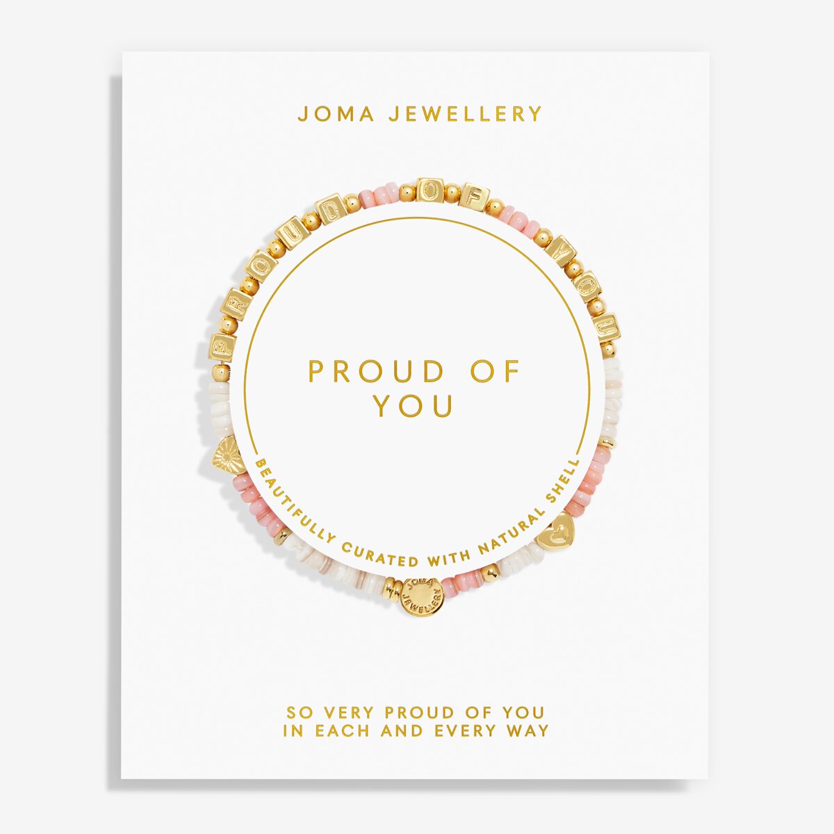 A Joma Jewellery 'Proud of You' beaded bracelet displayed on its white presentation card, featuring gold letter beads spelling 'LOVE' and a gold heart charm, with pink and white beads.