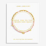 A pink and gold beaded bracelet displayed on a white Joma Jewellery card. The bracelet features natural shell segments, gold letter beads spelling out 'LOVE YOU TO THE MOON AND BACK', and a gold crescent moon charm.