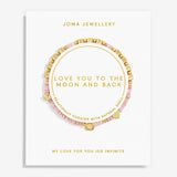 A pink and gold beaded bracelet displayed on a white Joma Jewellery card. The bracelet features natural shell segments, gold letter beads spelling out 'LOVE YOU TO THE MOON AND BACK', and a gold crescent moon charm.