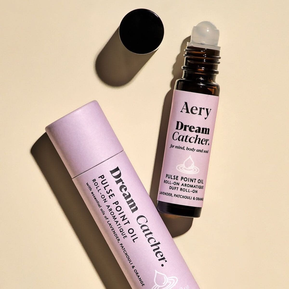 Two Aery Dream Catcher products on a beige background