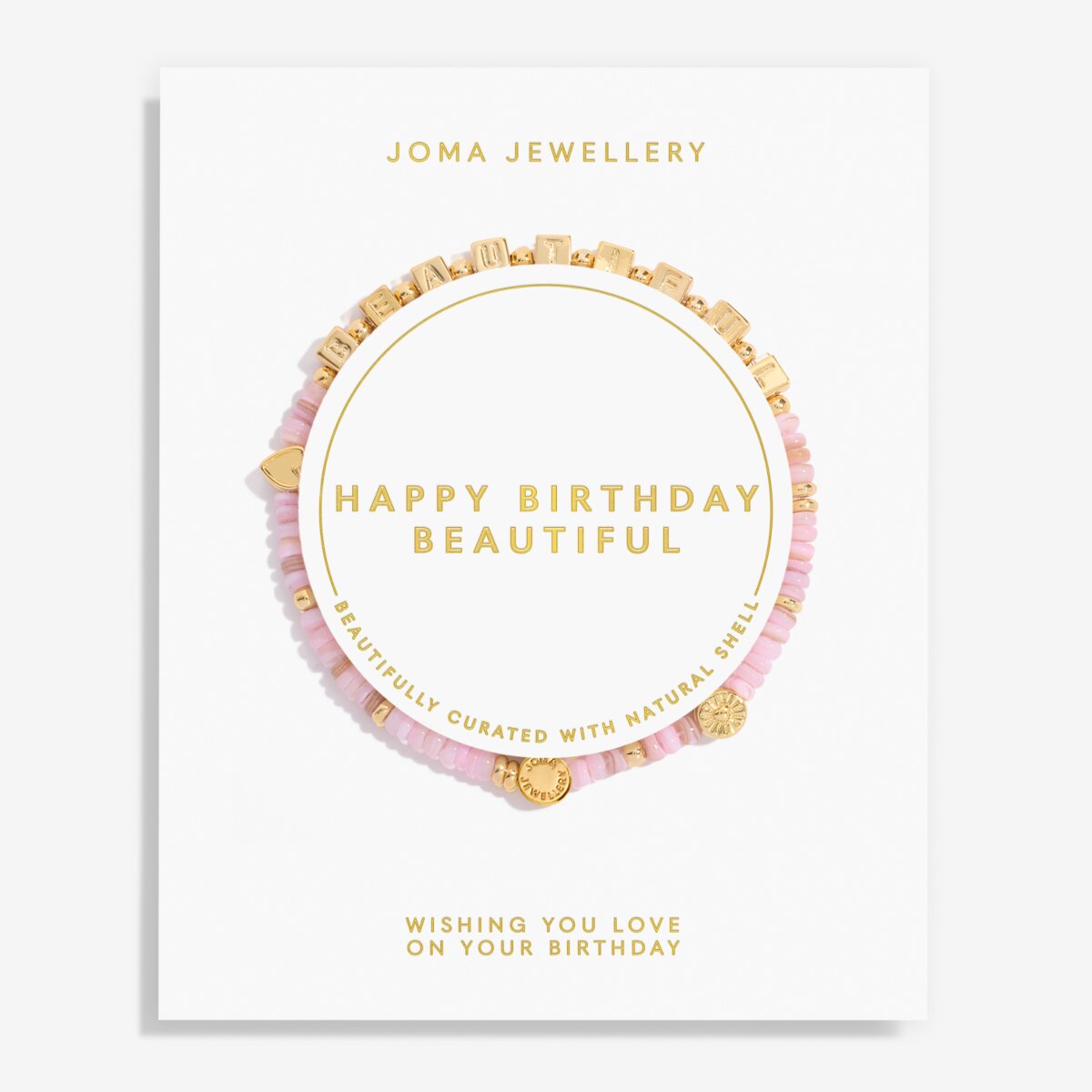 A Joma Jewellery 'Happy Birthday Beautiful' bracelet gift set on a white display card. The set features a pink beaded bracelet with gold cube charms, a pink beaded bracelet with gold heart charms, and a gold chain bracelet with gold cube charms, all arranged on a white card with gold lettering.