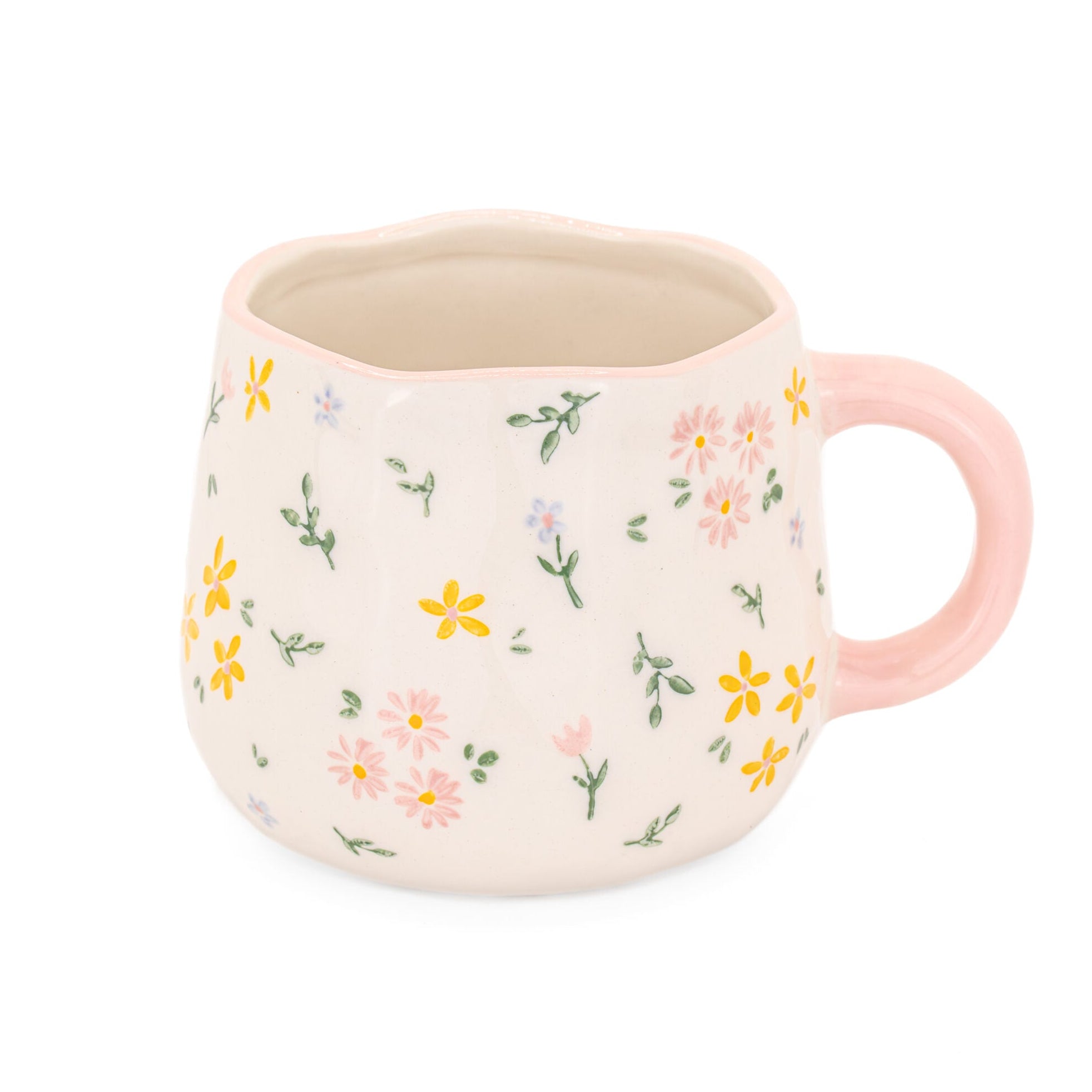 Ceramic mug with floral pattern and pink handle on a white background