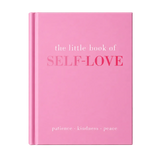 A pink hardcover book titled 'the little book of SELF-LOVE' with the subtitle 'patience • kindness • peace' on a light marble surface against a neutral background.