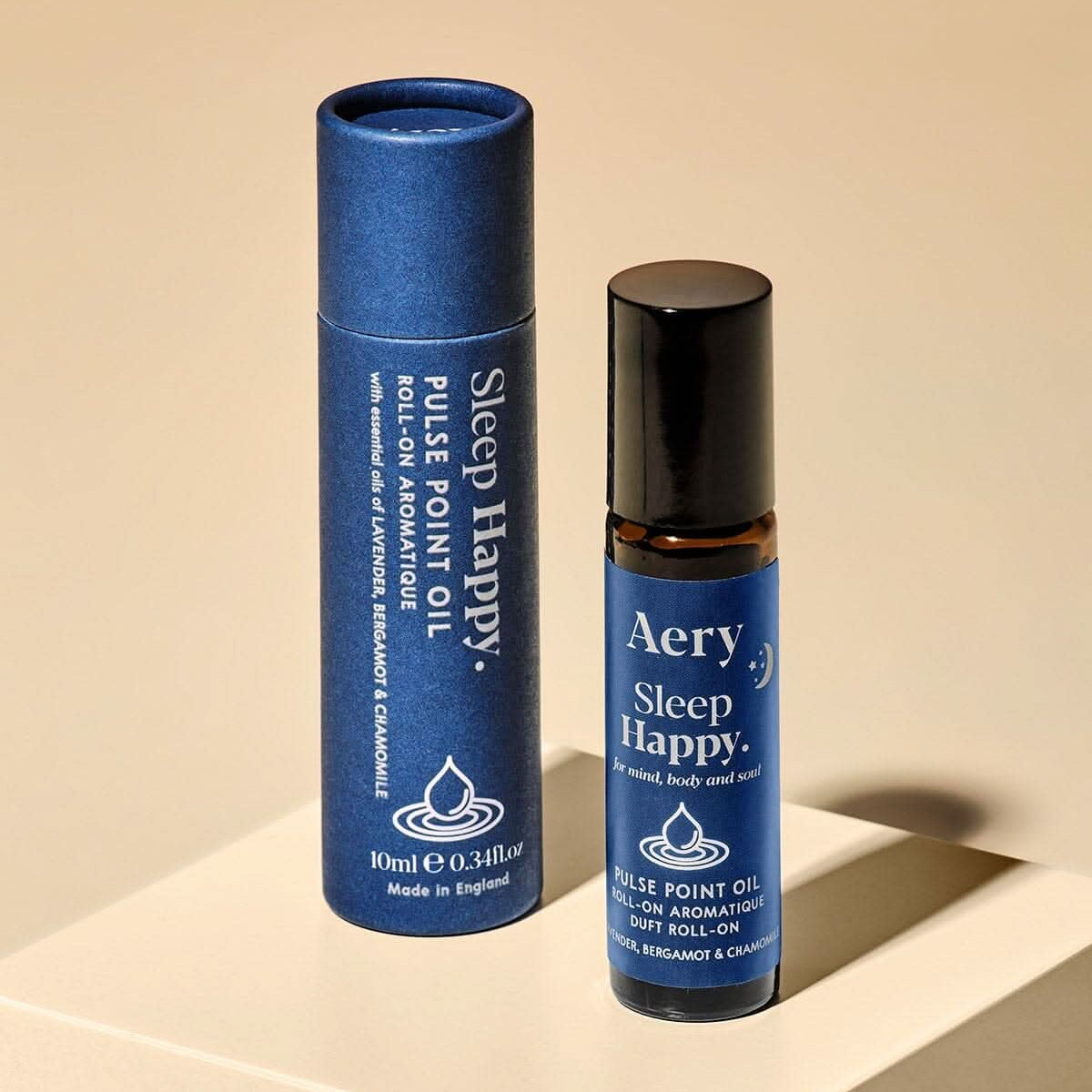 Sleep Happy roll-on aromatherapy oil by Aery on a beige background