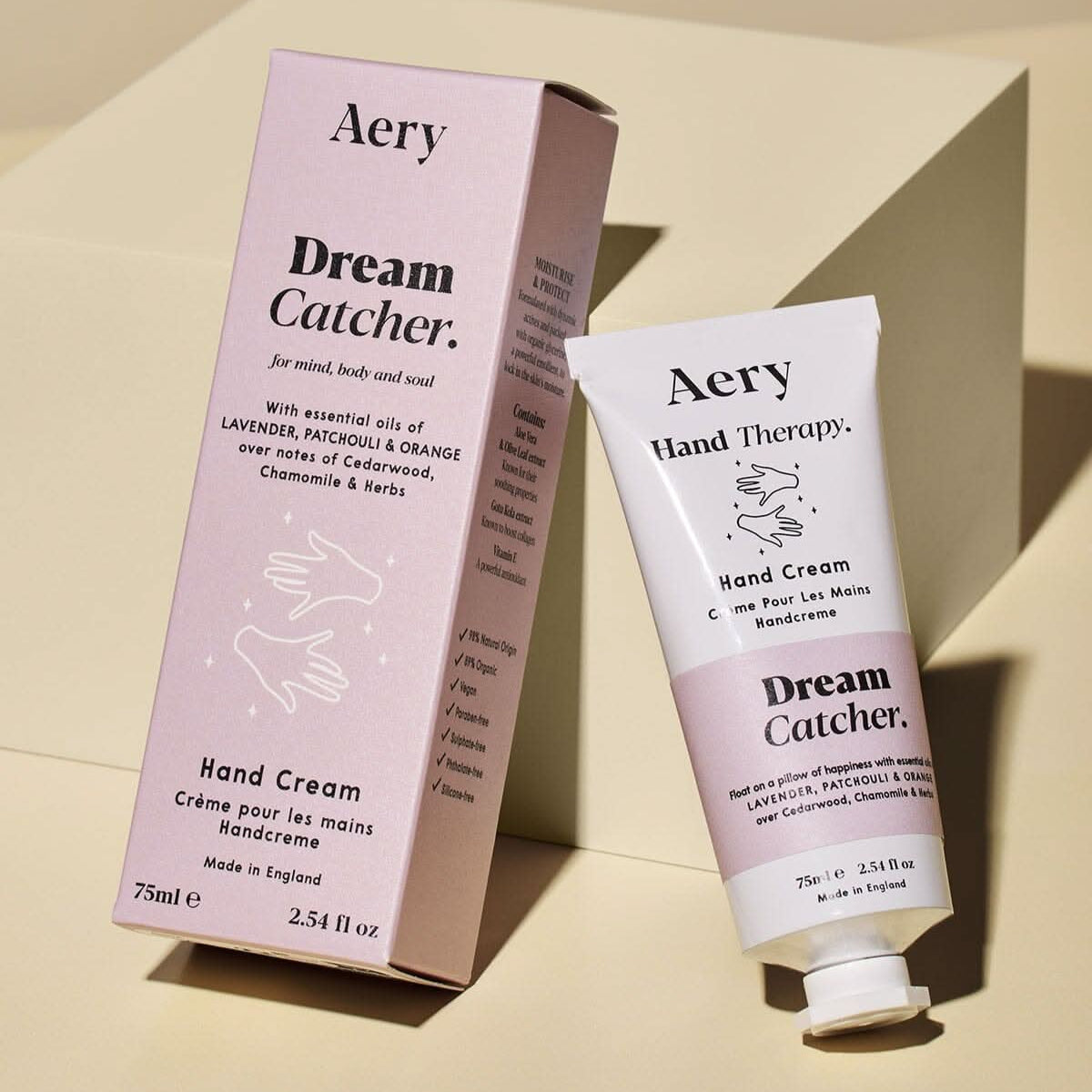 Aery Dream Catcher hand cream and packaging on a beige background