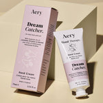 Aery Dream Catcher hand cream and packaging on a beige background