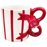A white ceramic mug with red vertical stripes and a red handle shaped like a candy cane, featuring a hanging tag that reads 'Candy Cane Love'.